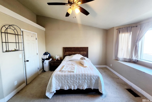 carpeted bedroom featuring ceiling fan