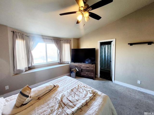 bedroom featuring ensuite bath, light carpet, ceiling fan, and vaulted ceiling