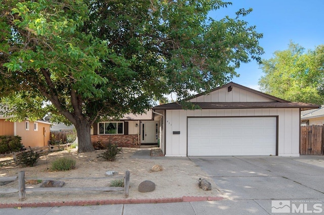 ranch-style house featuring a garage