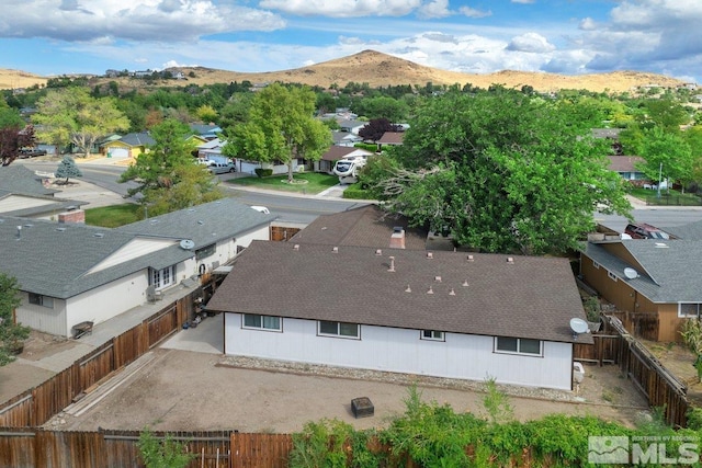 birds eye view of property with a mountain view