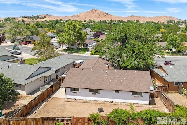 birds eye view of property with a mountain view