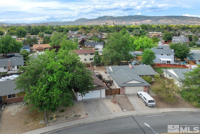 birds eye view of property featuring a mountain view