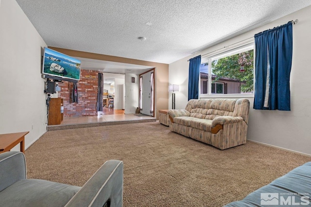 living room featuring carpet flooring and a textured ceiling