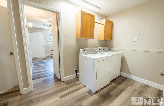 washroom with ceiling fan, light hardwood / wood-style flooring, cabinets, and independent washer and dryer