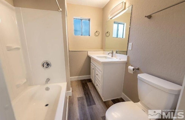 full bathroom with toilet, shower / bath combination, hardwood / wood-style floors, and vanity