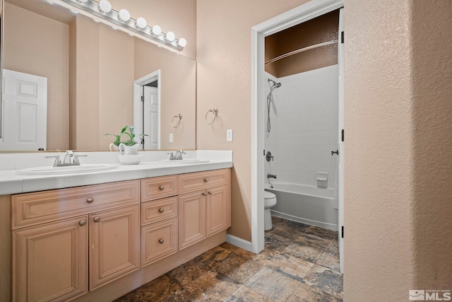 full bathroom featuring toilet, vanity, and shower / bathtub combination