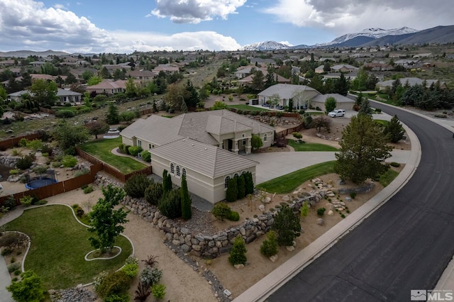 birds eye view of property featuring a mountain view