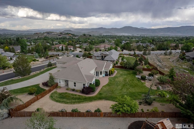 birds eye view of property with a mountain view