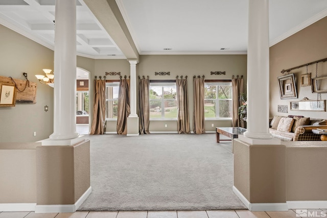 carpeted living room featuring beamed ceiling, crown molding, a chandelier, and ornate columns