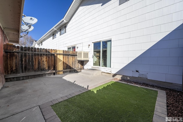 back of house featuring a yard and a patio