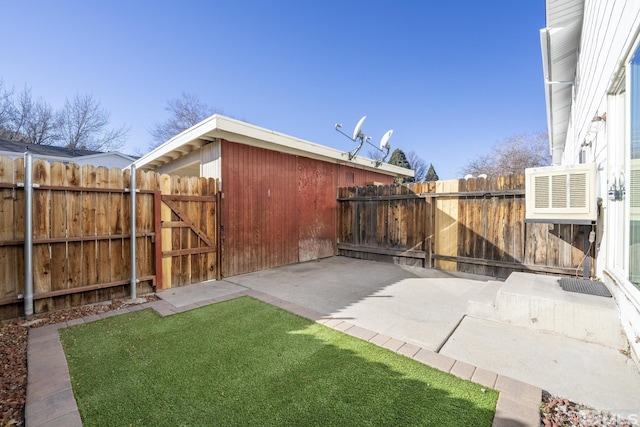 view of yard featuring cooling unit and a patio