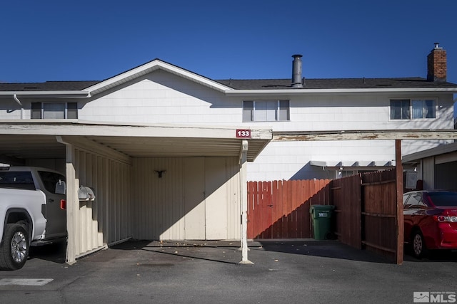 view of home's exterior with a carport