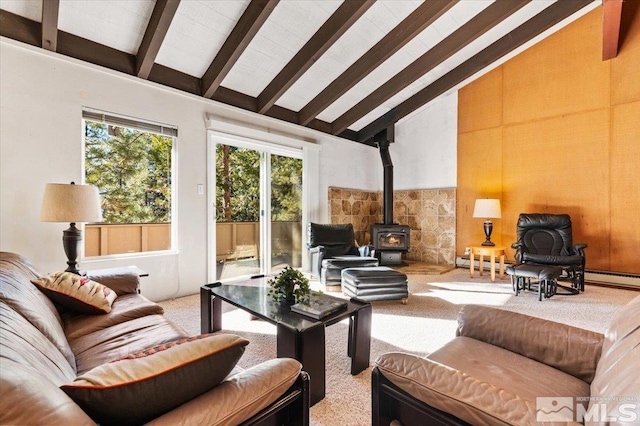 carpeted living room with a baseboard heating unit, high vaulted ceiling, beam ceiling, and a wood stove