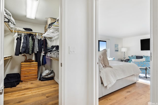 bedroom with hardwood / wood-style flooring and a closet