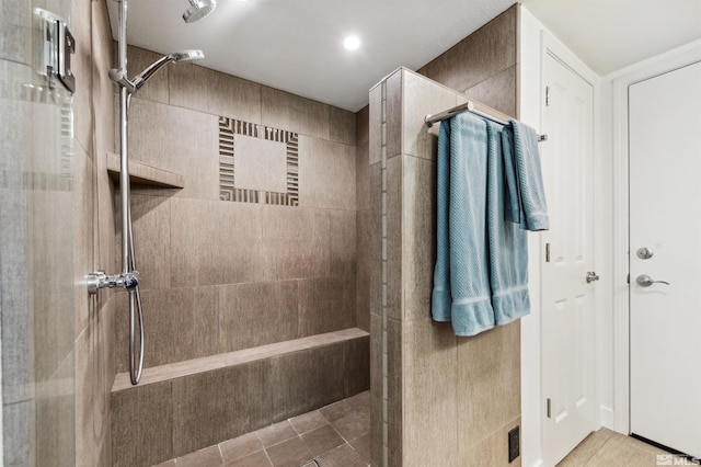 bathroom with tiled shower