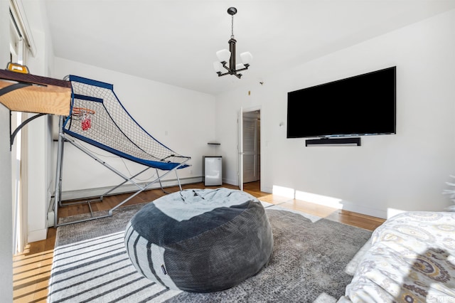 interior space featuring an inviting chandelier and wood-type flooring