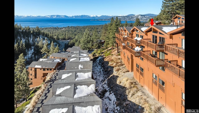 birds eye view of property featuring a water and mountain view