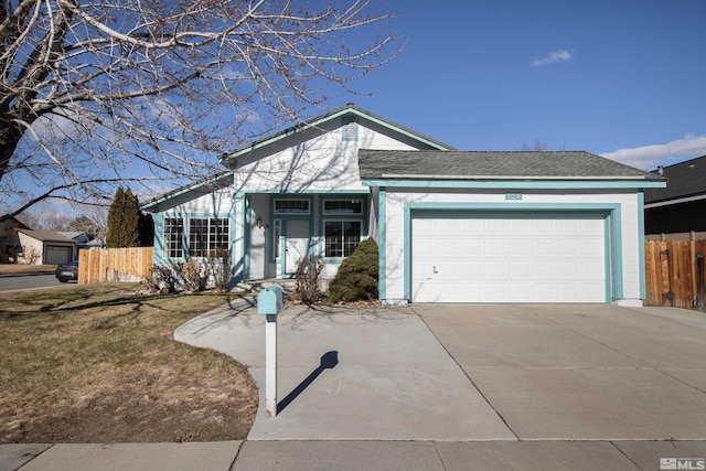 ranch-style house featuring a front lawn and a garage