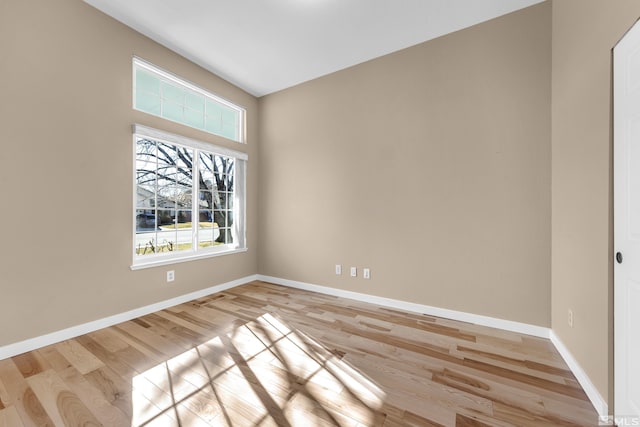 spare room featuring light hardwood / wood-style flooring