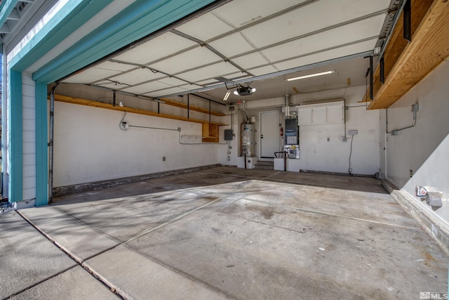 garage with strapped water heater and a garage door opener