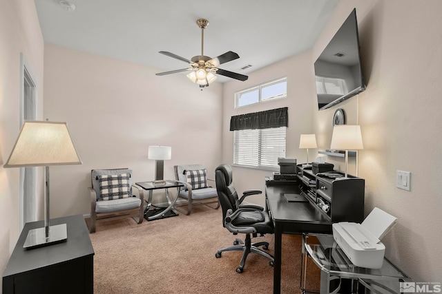 carpeted home office with ceiling fan