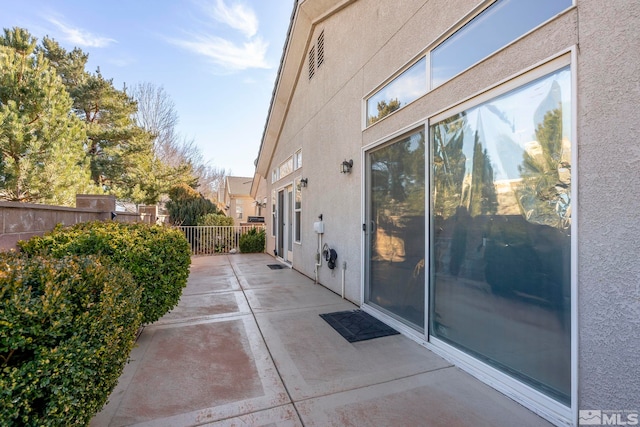 view of property exterior with a patio