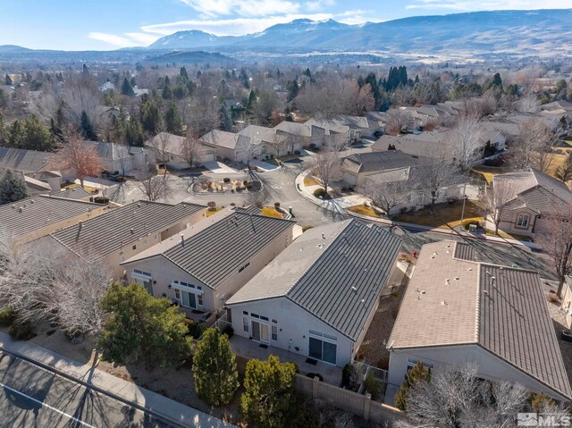 birds eye view of property with a mountain view