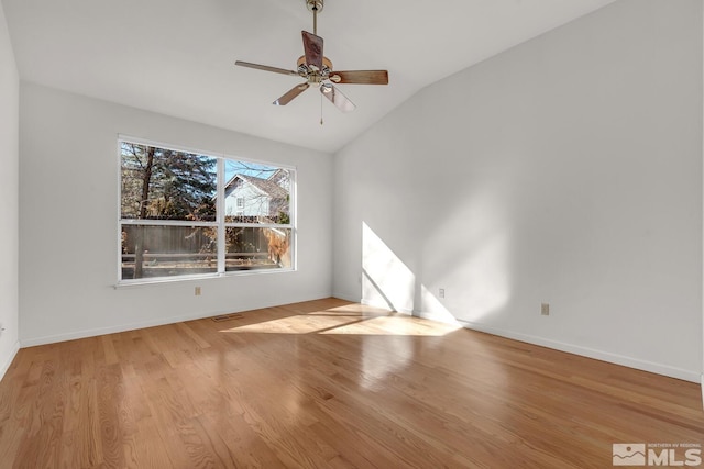 unfurnished room with light hardwood / wood-style floors, ceiling fan, and vaulted ceiling