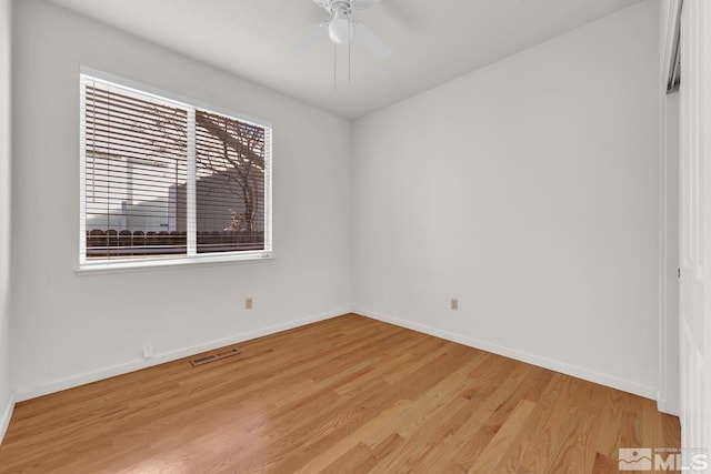 unfurnished room with ceiling fan and light hardwood / wood-style flooring