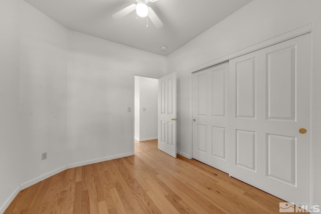 unfurnished bedroom featuring a closet, ceiling fan, and light hardwood / wood-style floors