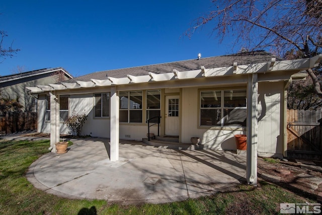 back of property with a patio area