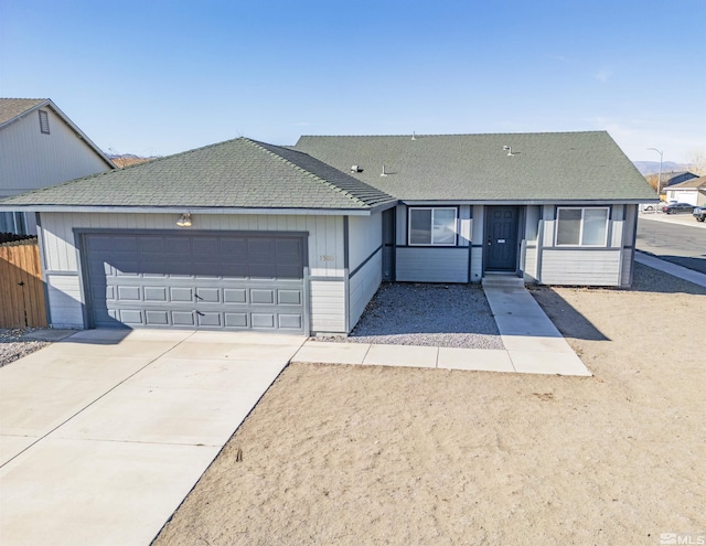 ranch-style home featuring a garage