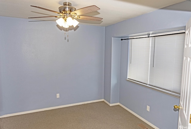 empty room with carpet flooring and ceiling fan