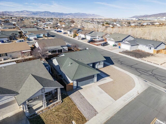 birds eye view of property featuring a mountain view