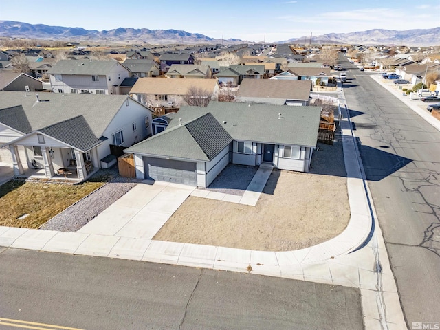 birds eye view of property featuring a mountain view