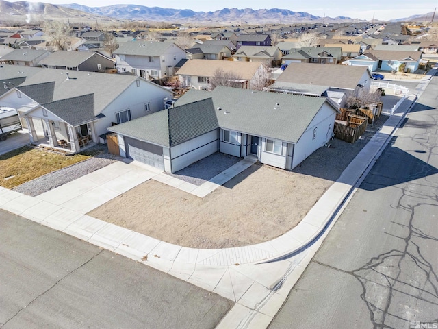 birds eye view of property with a mountain view