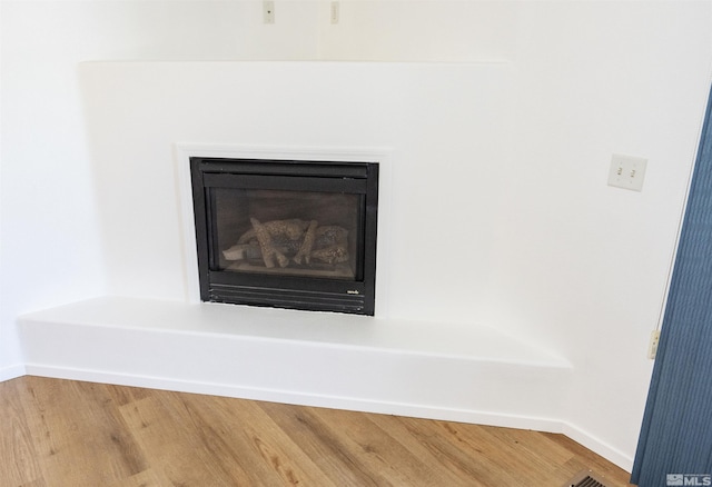 interior details featuring hardwood / wood-style floors