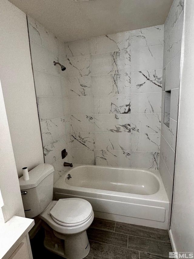 full bathroom featuring toilet, shower / washtub combination, and vanity