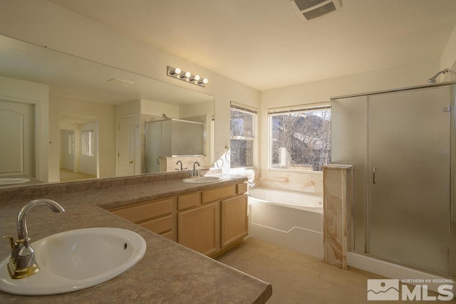 bathroom with independent shower and bath and vanity