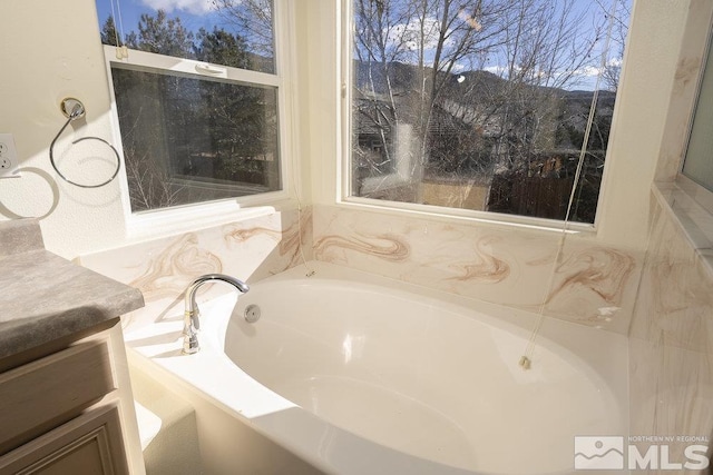 bathroom featuring a tub to relax in