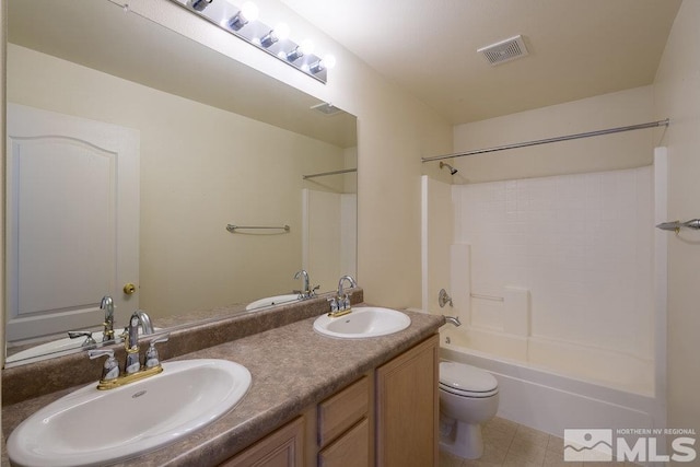 full bathroom featuring tub / shower combination, tile patterned flooring, vanity, and toilet