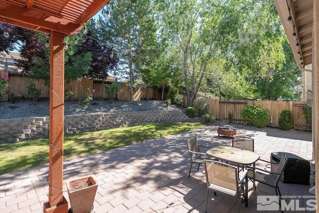 view of patio / terrace featuring a fire pit