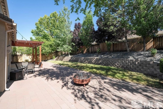 view of patio / terrace featuring an outdoor fire pit and a pergola