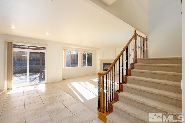 stairs featuring tile patterned floors