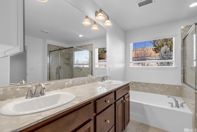 bathroom with vanity, tile patterned floors, and separate shower and tub