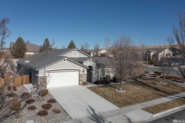 view of front of property with a front yard and a garage