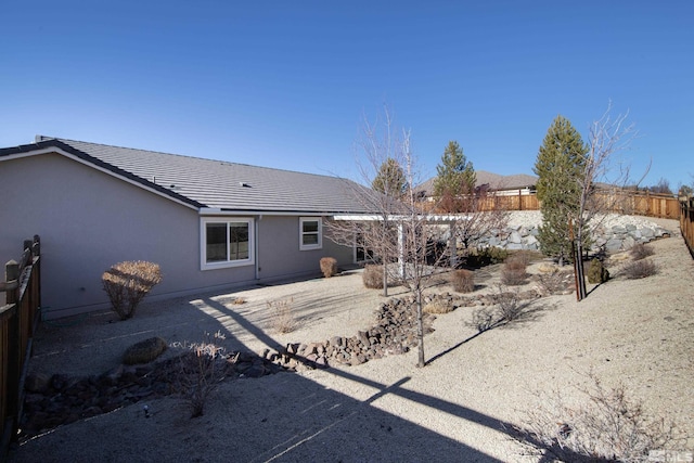 rear view of property featuring a patio