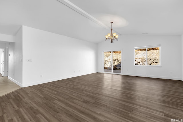 unfurnished living room featuring dark hardwood / wood-style flooring, a chandelier, and vaulted ceiling with beams