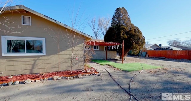 view of property exterior featuring a patio area