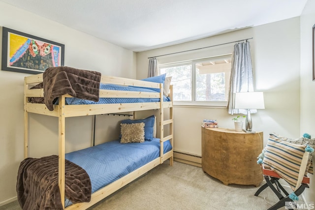 bedroom with a baseboard radiator and carpet flooring